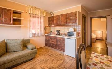 Фото номера Апартаменты с видом на сад и доступом в спа-центр Гостевой дом Németh Resort г. Совата 4